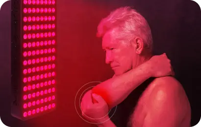 Man with arthritis holding is elbow due to pain